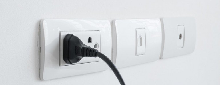 Plug plugged in a wall socket