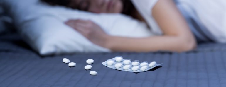 lady sleeping with sleeping pills