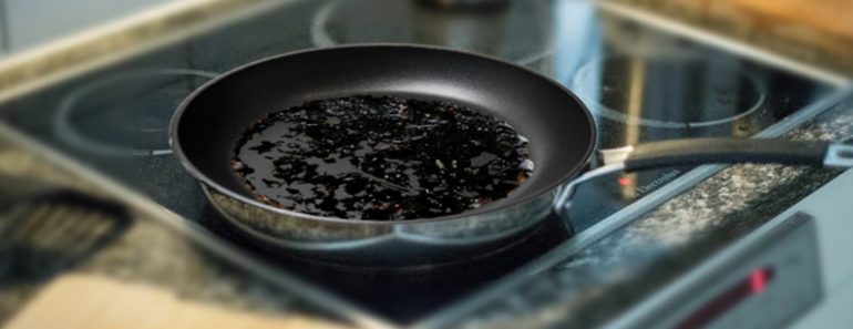 Burnt food in a pan in a kitchen