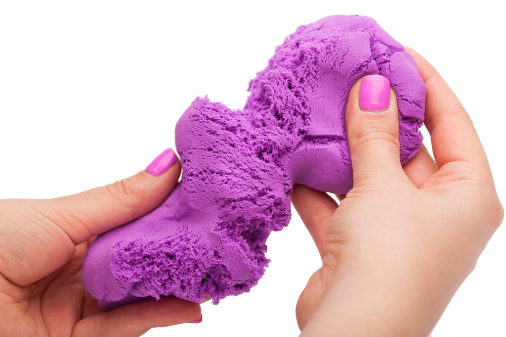 https://www.scienceabc.com/wp-content/uploads/2019/08/Close-up-of-a-photo-in-the-hands-of-kinetic-sand-on-a-white-background-ImageTsyb-Olehs.jpg