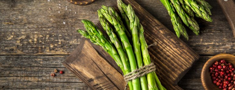 banches of fresh green asparagus on wooden background( Anna Shepulova)S