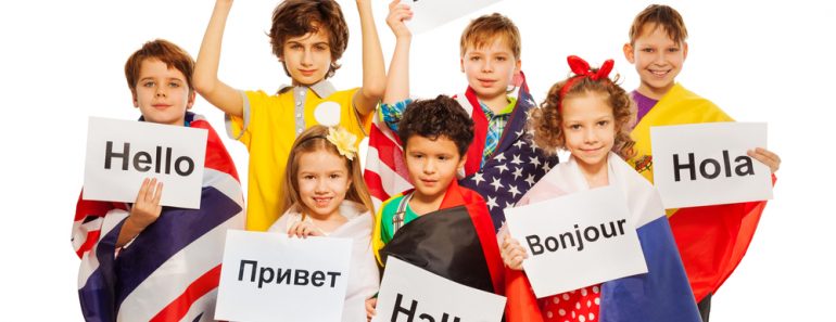 Kids holding greeting signs in different languages(Sergey Novikov)s