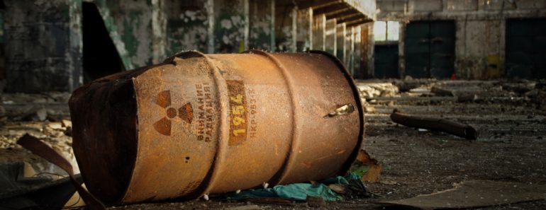 Radioactive warning on old rusty barrel in destroyed and forgotten building(Skorzewiak)s