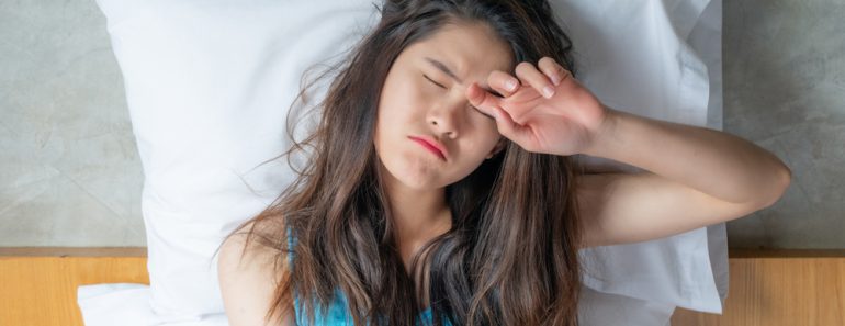 Portrait of young Asian woman feeling sleepy and tired after sleepless night(Boyloso)s