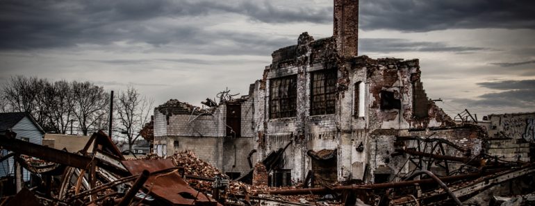 Wide angle shot of a dramatic and gloomy photo of a collapsing vintage brick industrial building left abandoned(R. Wellen Photography)s