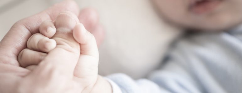 Little,Newborn,Baby,Holding,Parent's,One,Hand,,Close-up,Macro,Shot.